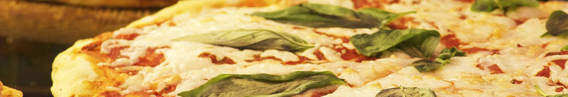 Eating Pizza at Village Pizza restaurant in Rochester, NH.